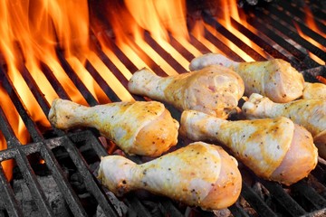 Сhicken Legs On The Hot Flaming Barbecue Grill