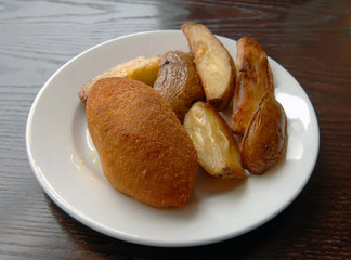 fried cutlet and baked potato