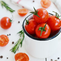 Ripe tomatoes, fresh rosemary and black pepper, square