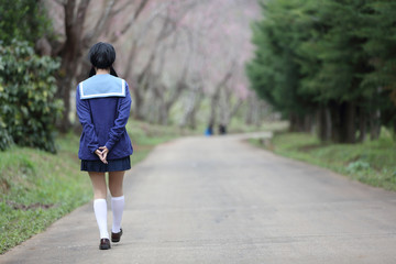 Obraz premium asian schoolgirl with nature