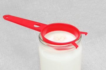 Kefir (Tibetan,milk), fungus in strainer and in jar with milk.