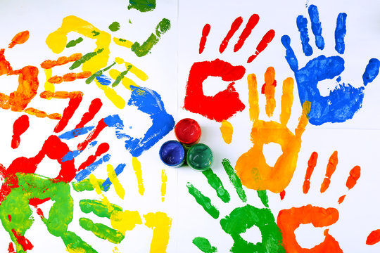 Hand prints of paint with paint on white background