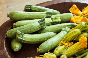 Fresh courgettes or zucchini with flowers