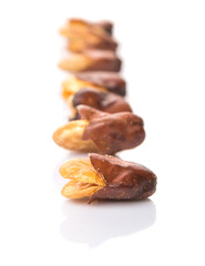 Obraz premium Salted broad beans or vicia faba over white background