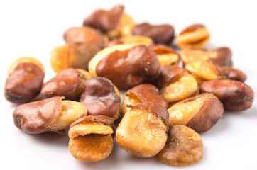 Salted broad beans or vicia faba over white background