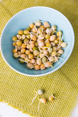Pea seeds with sprouts in a bowl.