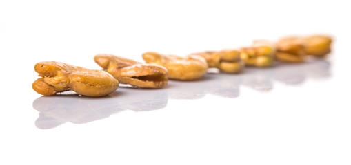 Salted broad beans or vicia faba over white background