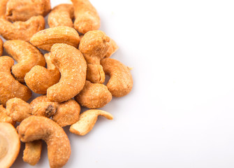 Roasted and salted cashew nut over white background