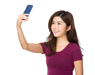 Young asian lady taking a selfie