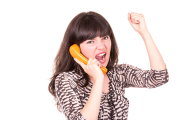 beautiful young woman using retro orange telephone