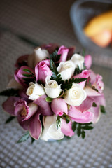 Pink wedding bouquet with roses and orchids