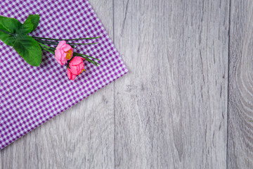 Small flowers on wooden background in rustic style