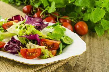 Vegetables salad on wooden table