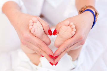 Baby feet in mother hands