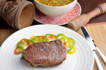 .steak with vinaigrette: sweet pepper, onion and tomato