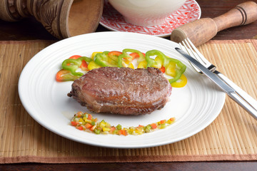 .steak with vinaigrette: sweet pepper, onion and tomato