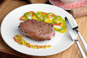 .steak with vinaigrette: sweet pepper, onion and tomato