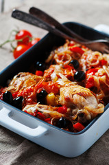 Cooked chicken with tomato, onion, pepper and olive
