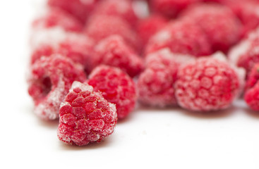Frozen raspberries on white