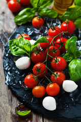 Fresh tomatoes, mozzarella and green basil