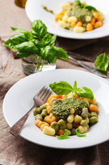 Colored gnocchi with pesto