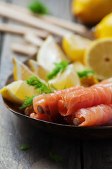 Smoked salmon with grissini and lemon