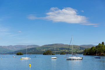 Fototapeta na wymiar UK Lake District boats and mountains in summer