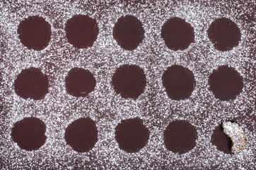  Brown cookie sheet with sugar and cookie shape.