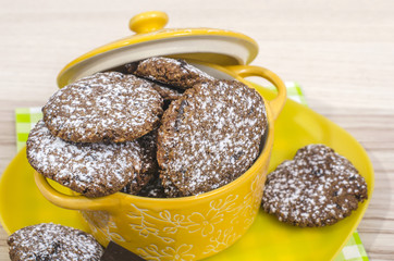 Delicious home made chocolate chip cookie in a yellow bowl.