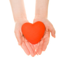 Red heart in  hands, isolated on white