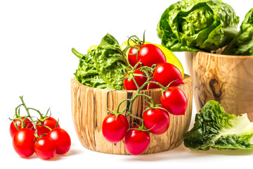 bunch of vegetables in the wooden bowl