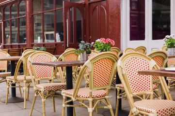 Fototapeta na wymiar Chairs and tables outside cafe