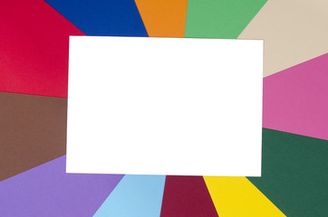 White sheet paper on rainbow colors background.