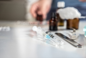 Syringe with glass vials and medications pills drug
