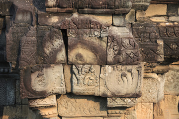 Ancient temple wall with stone fresco - beautiful design detail