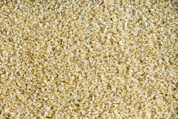 Background texture of cracked or crushed wheat