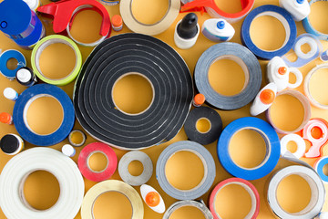 Striking abstract pattern of glue pots and tape