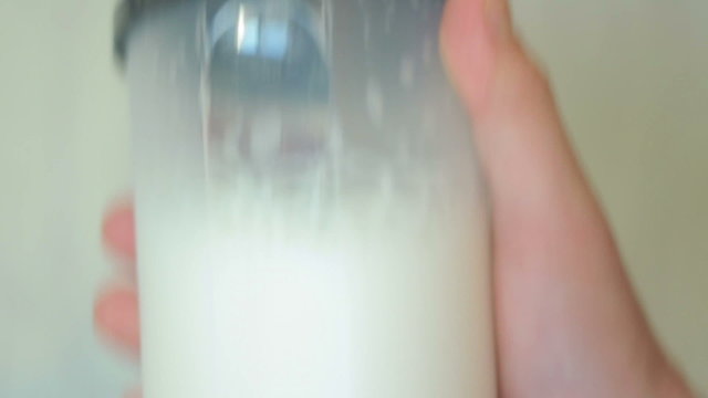 protein gainer shaked in plastic bottle