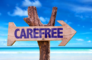 Carefree sign with a beach on background
