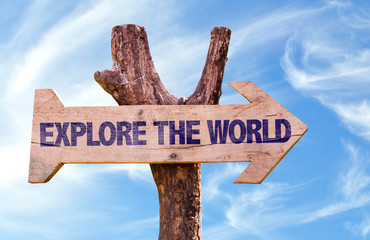Explore the World sign with sky background
