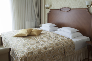 king size bed with pillows in luxury apartment