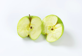 Halved green apple