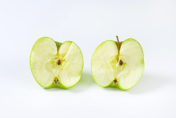 Halved green apple