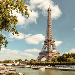 Eiffel Tower against blue sky, Paris, France. Scenic view of Seine River in summer.