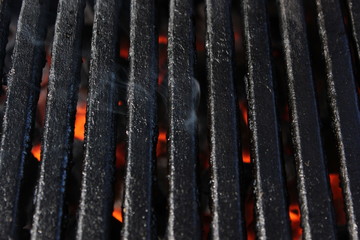 Close up BBQ grill with smoke