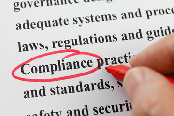 Word Compliance Circled by Hand with Red Pen