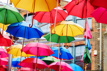 Colorful umbrellas on a street of London