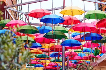 Fototapeta na wymiar Colorful umbrellas on a street of London