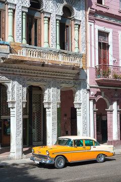 Old car on a grungy street in Havana