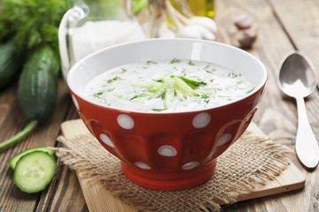 Summer soup with cucumbers, yogurt and fresh herbs